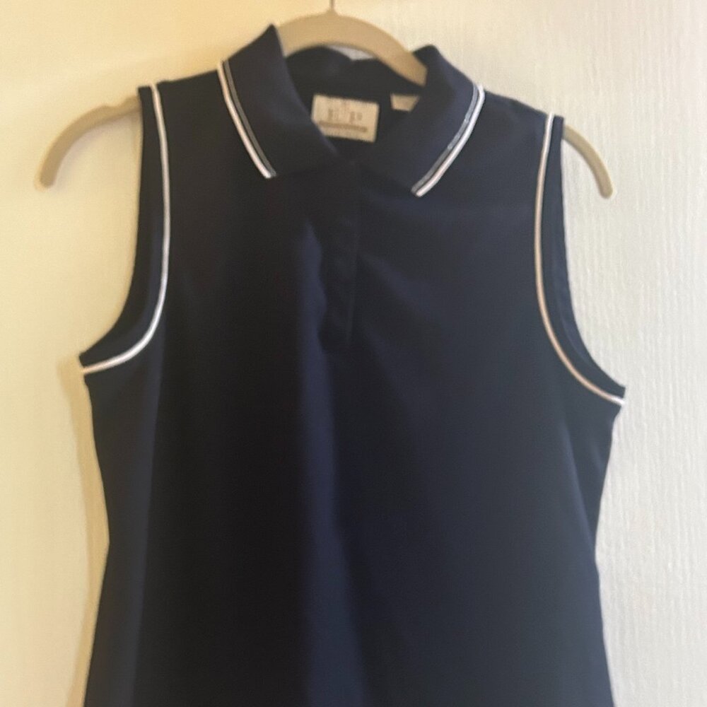 Size Medium EP PRO Navy with white and touch of silver trim sleeveles golf shirt